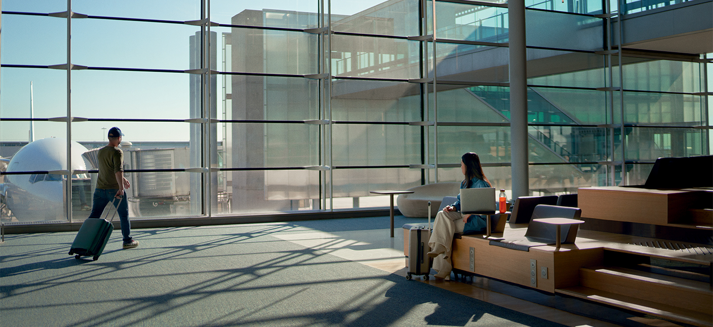 header image - a lady sitting in the Extime lounge